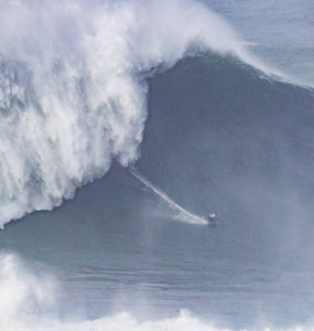 little surfer in BIG wave